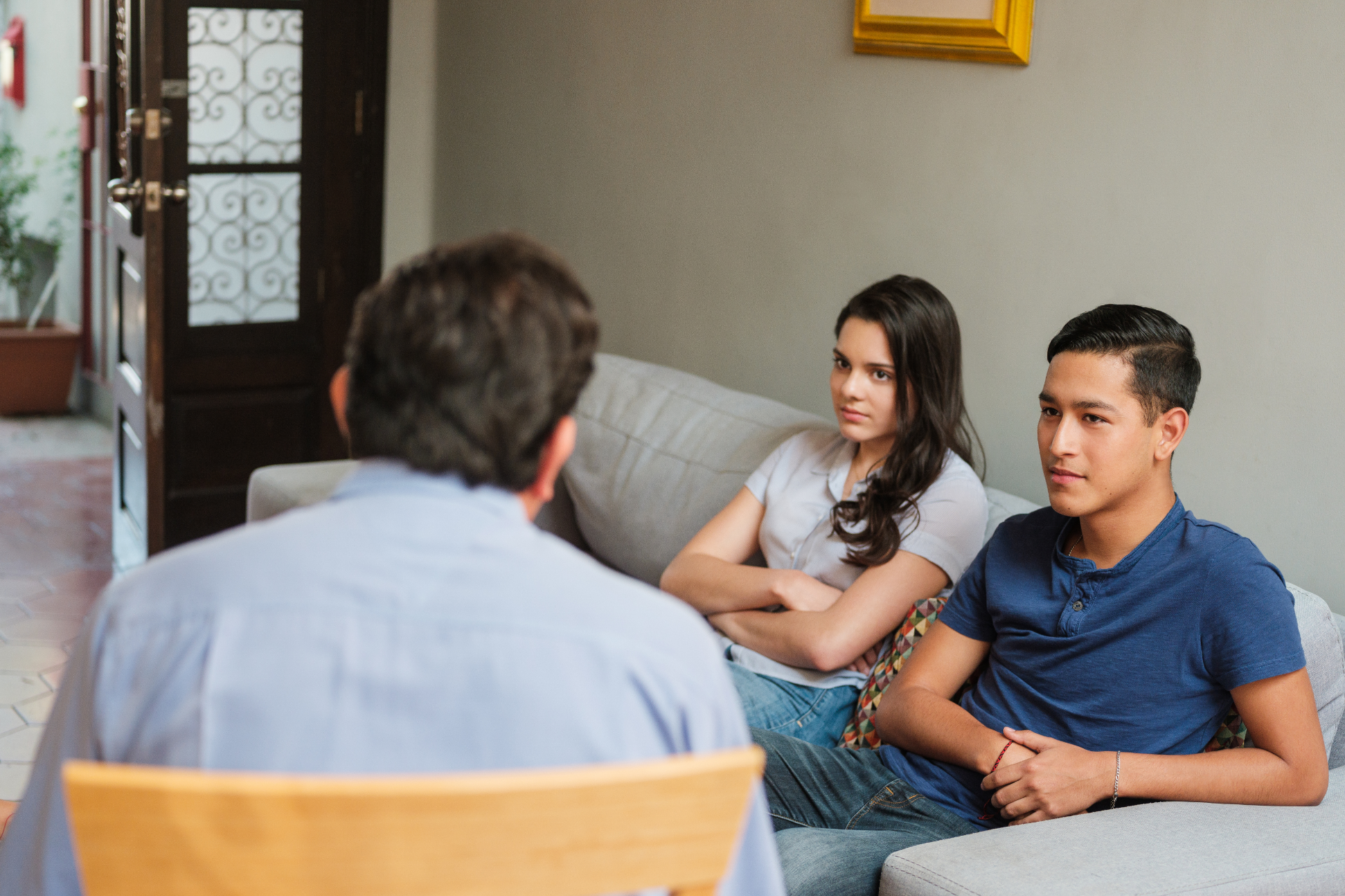 Dad Talking to Two Teenagers