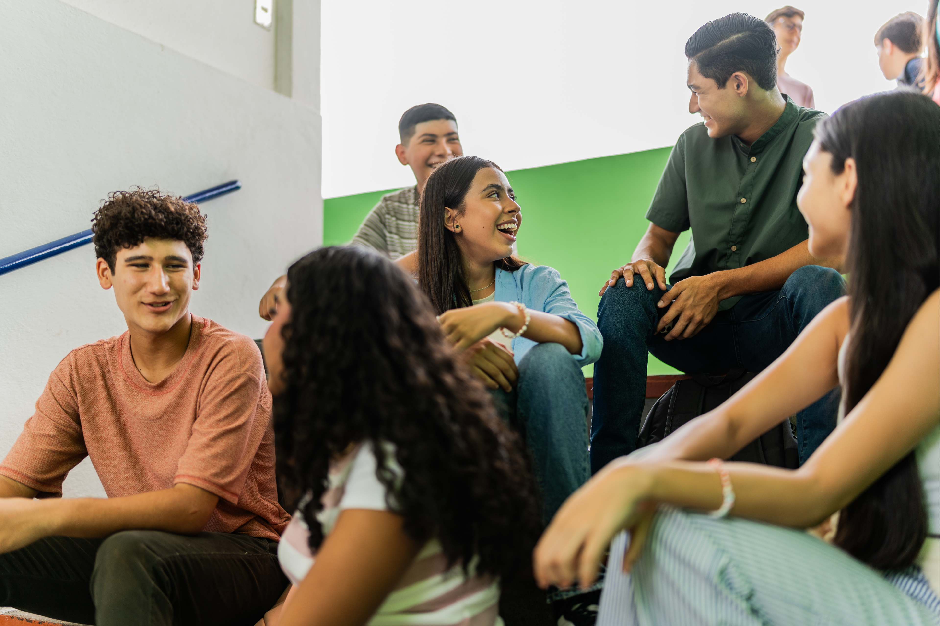 Teenagers Sat on Steps