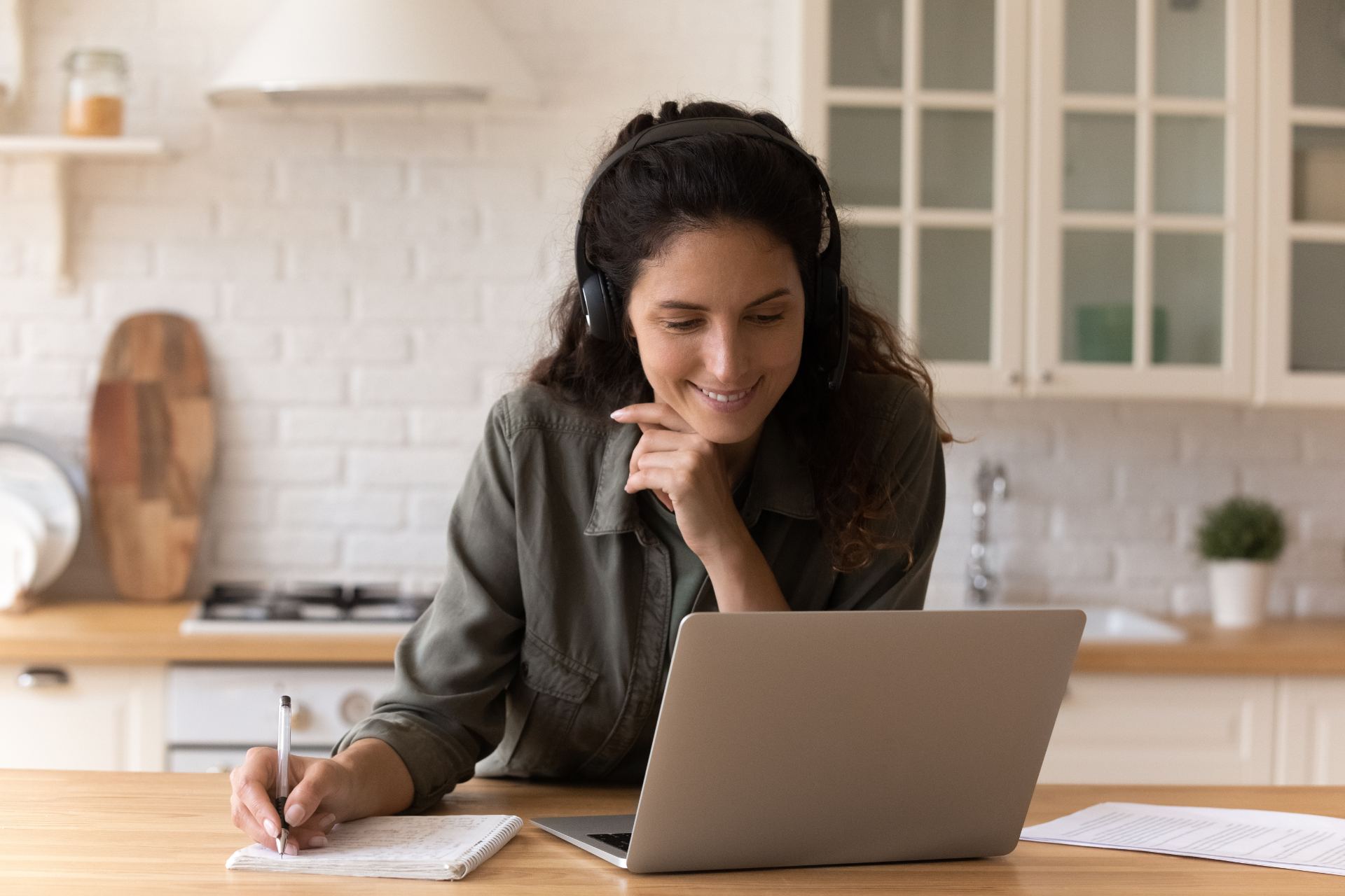 Woman Smiling at Laptop